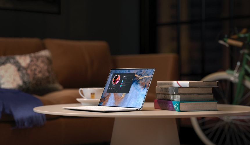 Laptop on a coffee table showing a website